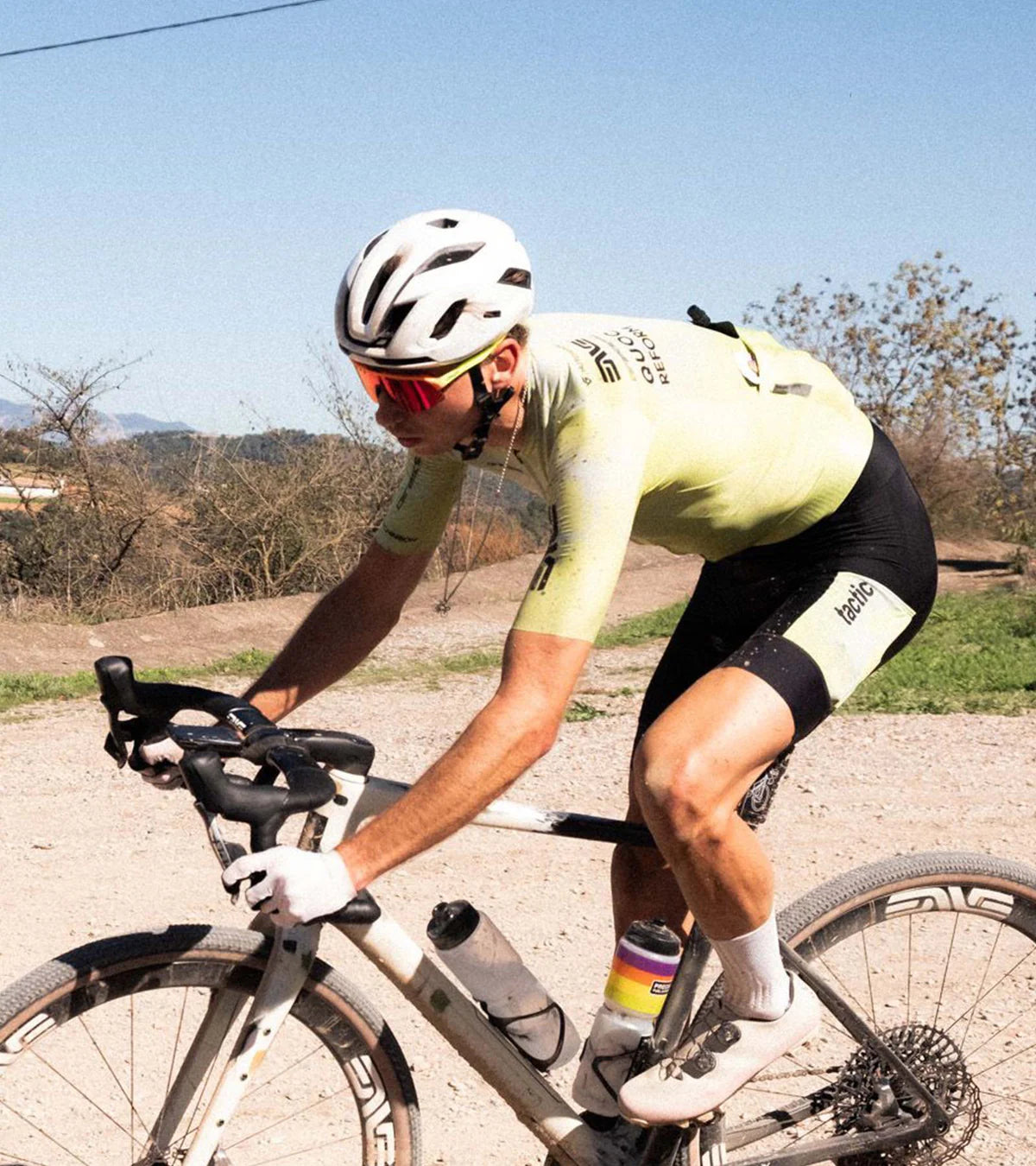 Cyclist wearing QUOC Gran Tourer XC Off-Road Shoes in a gravel race, showcasing their performance and comfort on long rides.