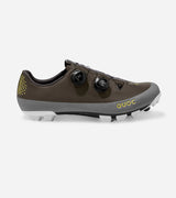 Side view of QUOC Gran Tourer XC Off-Road Shoe in brown and grey with yellow branding, built for rugged terrain and cycling performance.