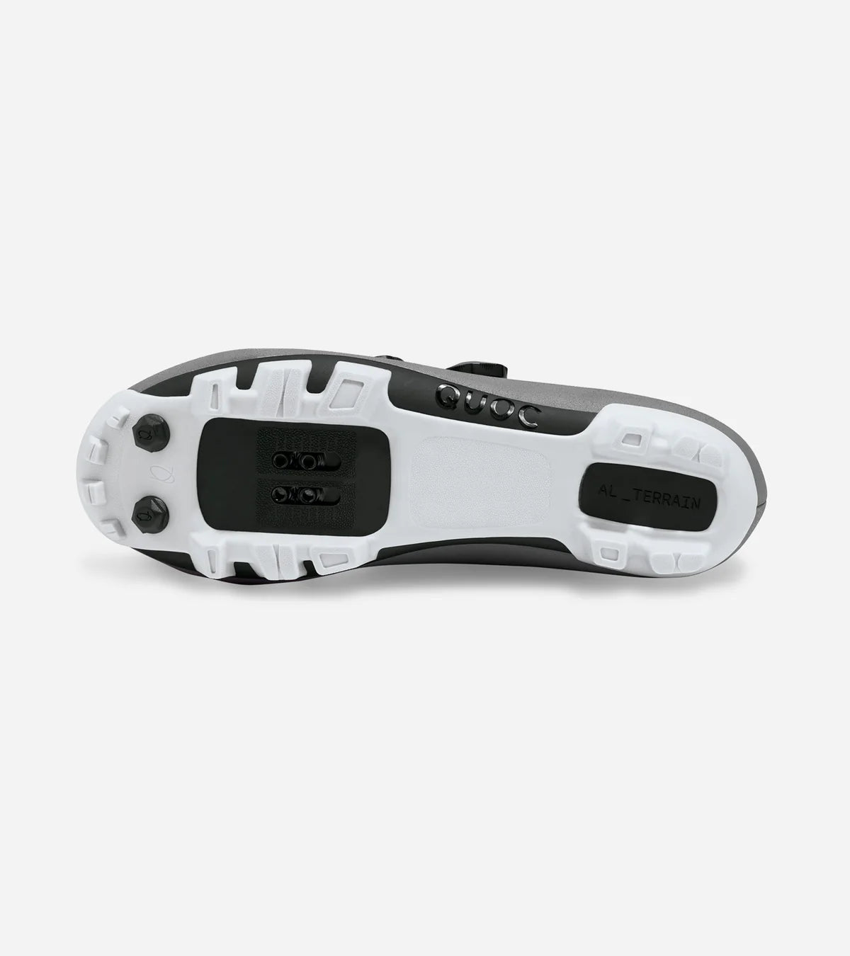 Outsole of QUOC Gran Tourer XC Off-Road Shoe in brown, showing aggressive tread and SPD cleat compatibility for off-road cycling.