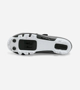 Outsole of QUOC Gran Tourer XC Off-Road Shoe in brown, showing aggressive tread and SPD cleat compatibility for off-road cycling.