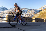 Cyclist riding Pinarello F1 bike in mountains