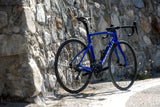 Pinarello F1 bike against stone wall