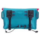 Cyber blue rectangular Ortlieb Velo-Sling 3L handlebar bag with black mounting brackets and adjustable straps.
