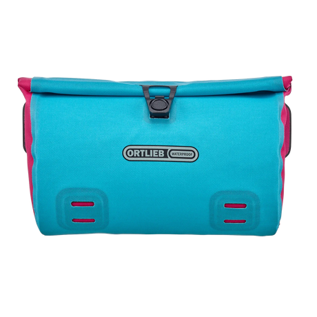 Cyber blue rectangular Ortlieb Velo-Sling 3L handlebar bag with black buckle closure and pink side accents.