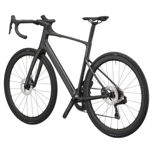 Carbon black Scott Addict 20 road bike from a rear three-quarter angle showing the dropped seat stays and disc rotors.