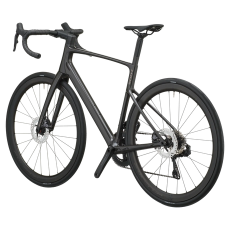 Carbon black Scott Addict 20 road bike from a rear three-quarter angle showing the dropped seat stays and disc rotors.