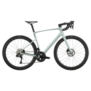 Sand green Scott Addict 30 road bike, drive-side profile with Shimano 105 groupset and disc brakes.