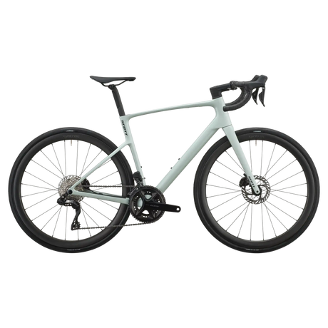 Sand green Scott Addict 30 road bike, drive-side profile with Shimano 105 groupset and disc brakes.