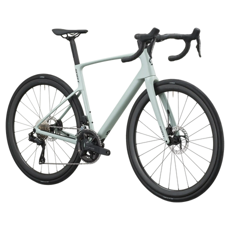 Sand green Scott Addict 30 road bike from a front three-quarter angle showing the aero head tube and drop bars.