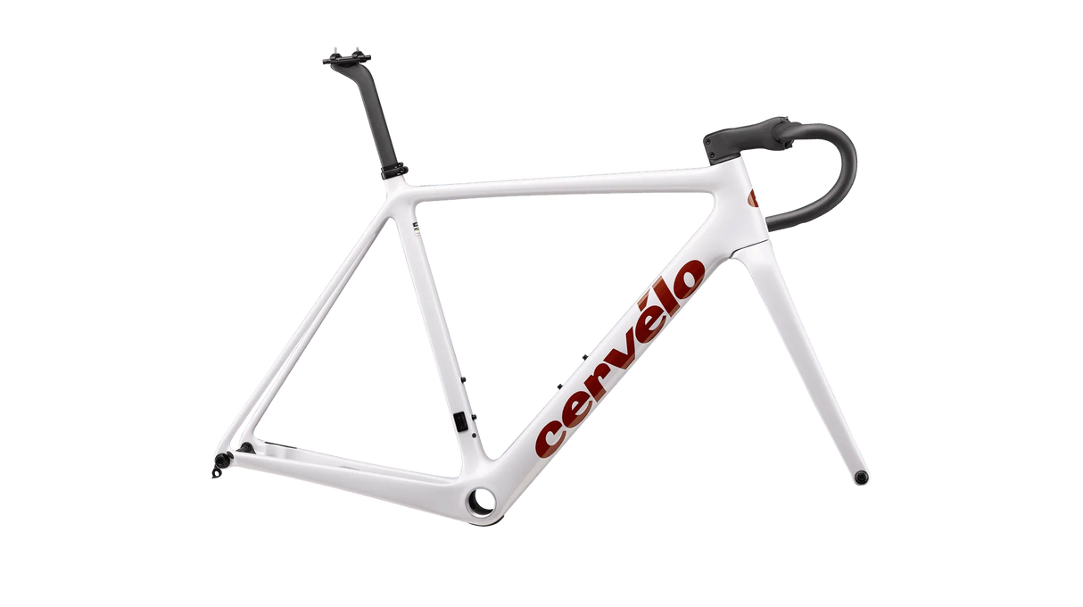 The Cervelo R5CX Frameset features a sleek white design with the brand name "Cervelo" elegantly emblazoned in red on the down tube. This frame, ideal for cyclocross bikes, comes with a seat post and handlebars, providing a striking contrast against the black background.