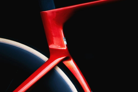 Detail of Cervélo S5 Red XPLR AXS 1's rear triangle and seat tube junction, showcasing sleek carbon construction and aerodynamic shaping.