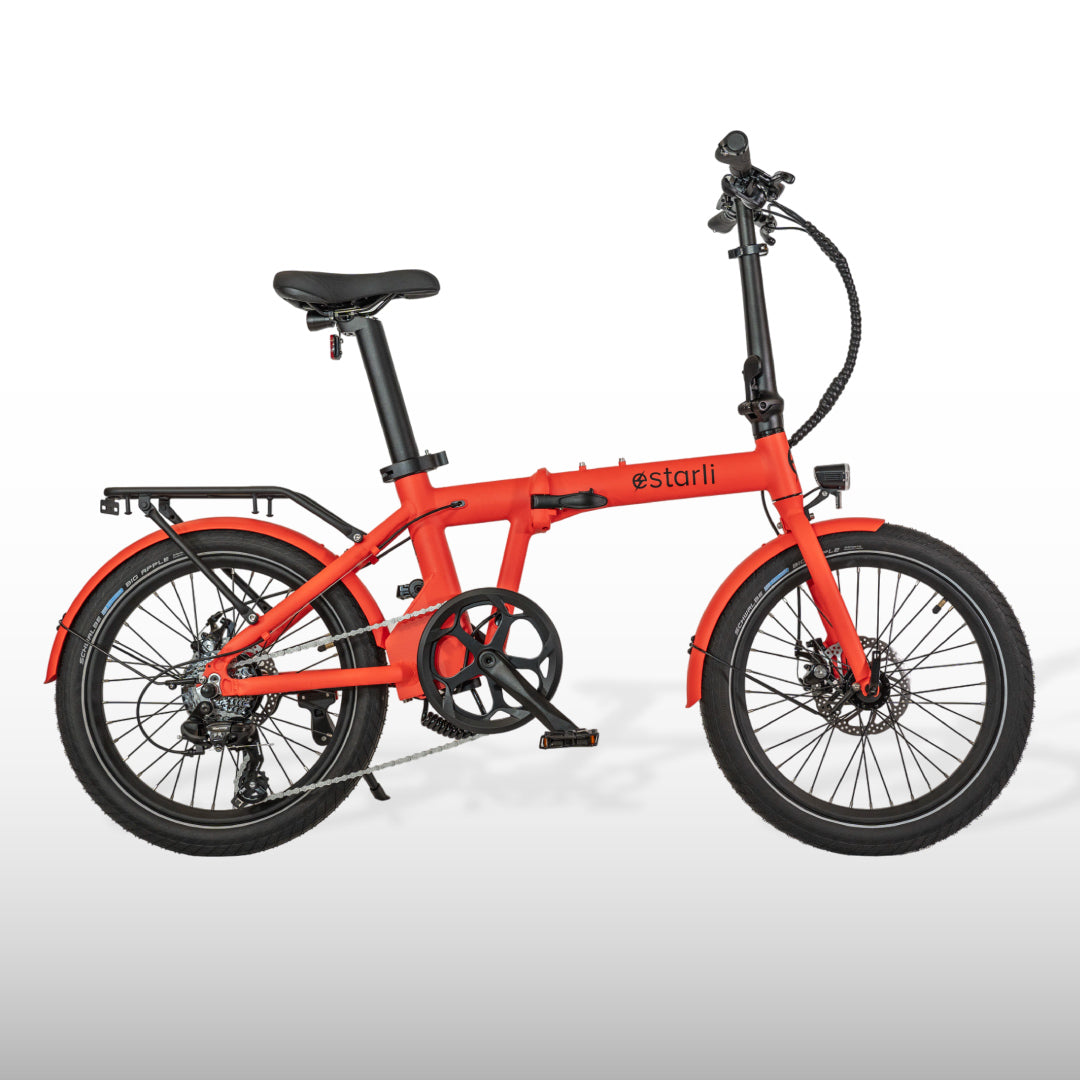 Bright red estarli E20.7 Comfort Hybrid E-Bike with rear rack and disc brakes, offering a bold look for everyday cycling adventures.