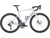 Violet pink electric road bike with lightweight frame, drop handlebars, and disc brakes.