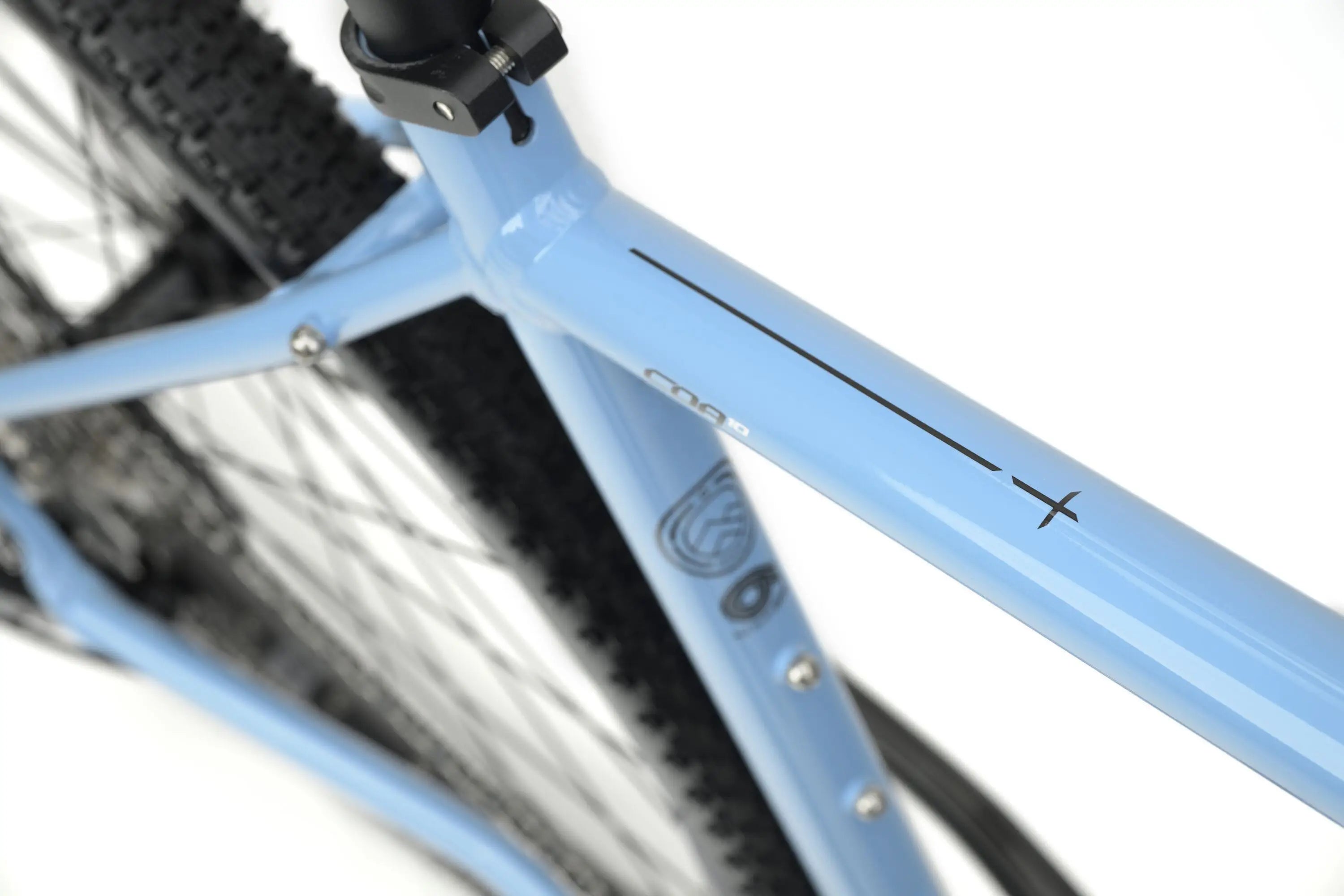 Light blue Genesis CDA 10 gravel bike frame with matte finish and subtle black logo details.