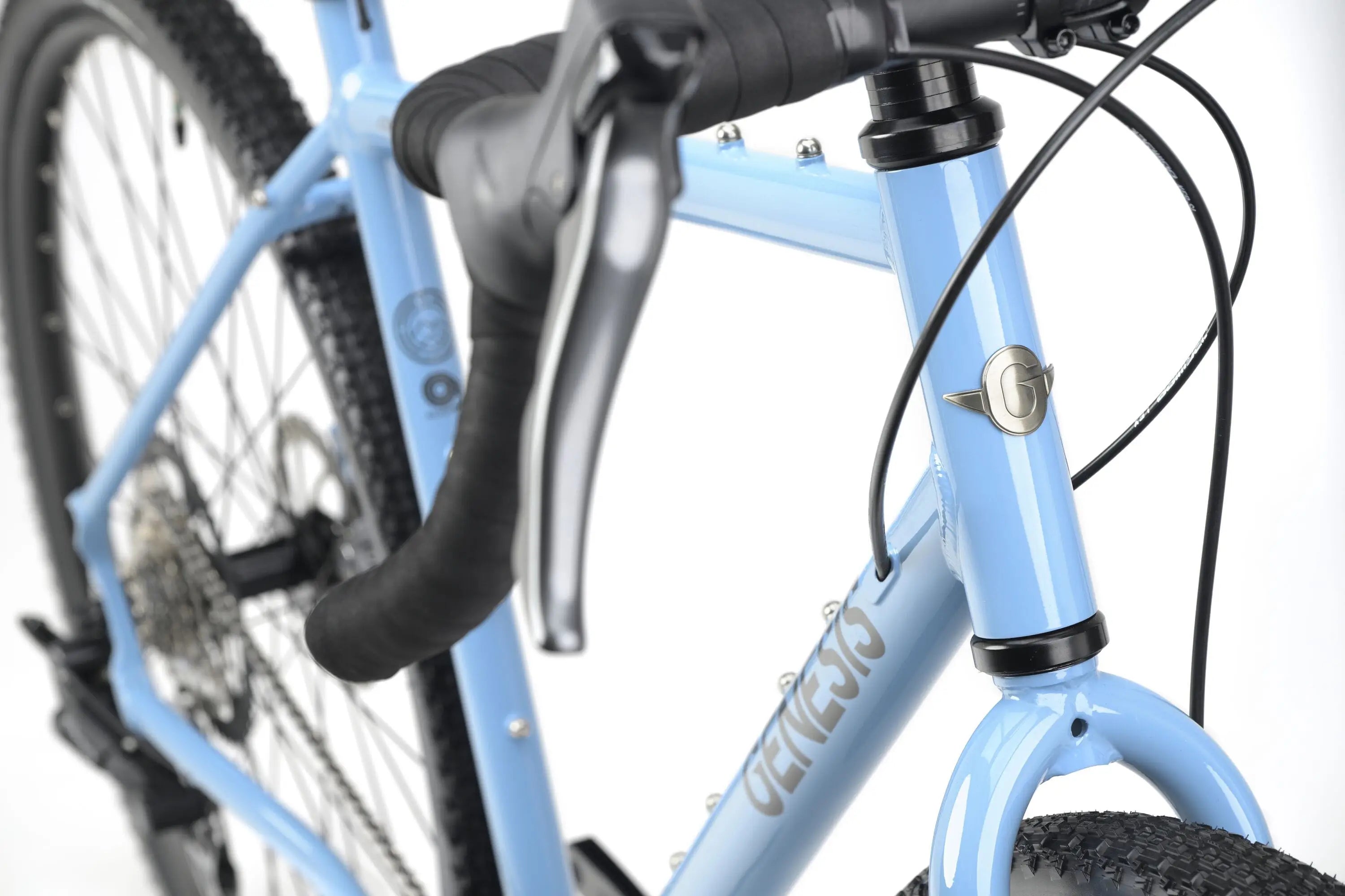 Light blue Genesis CDA 10 gravel bike with drop handlebars and brake cables on front fork.