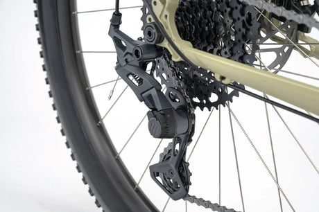 Rear derailleur of the Genesis Vagabond 10 Gravel Bike, designed for smooth and precise gear shifting on varied terrain.