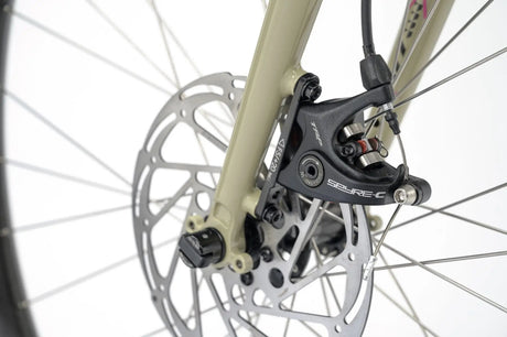 Front disc brake system of the Genesis Vagabond 10 Gravel Bike, ensuring strong and consistent braking performance on all terrains.