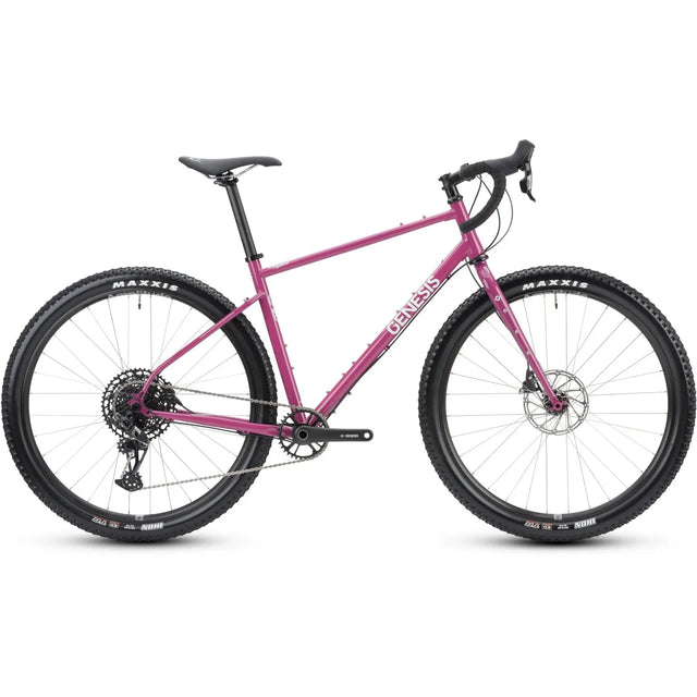 Genesis Vagabond 20 Gravel Bike in vibrant pink with drop handlebars and Maxxis tires, designed for off-road and adventure cycling.