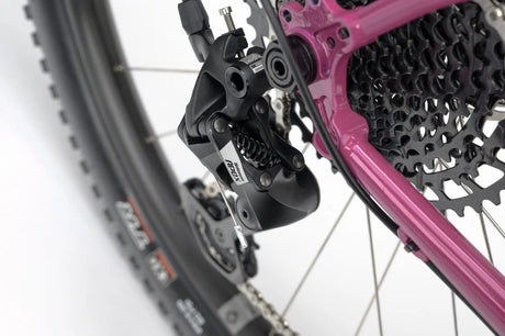 Rear derailleur of the Genesis Vagabond 20 Gravel Bike, featuring a high-performance SRAM drivetrain for precise shifting.