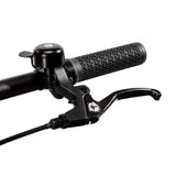 A close-up of the Frog City 61 Kids Hybrid Bike's handlebar showcases a black textured grip, a small bell, and an 8-speed gear brake lever connected by a cable. The clean and minimalistic setup is accentuated by the lightweight Frog frame against a plain white background.