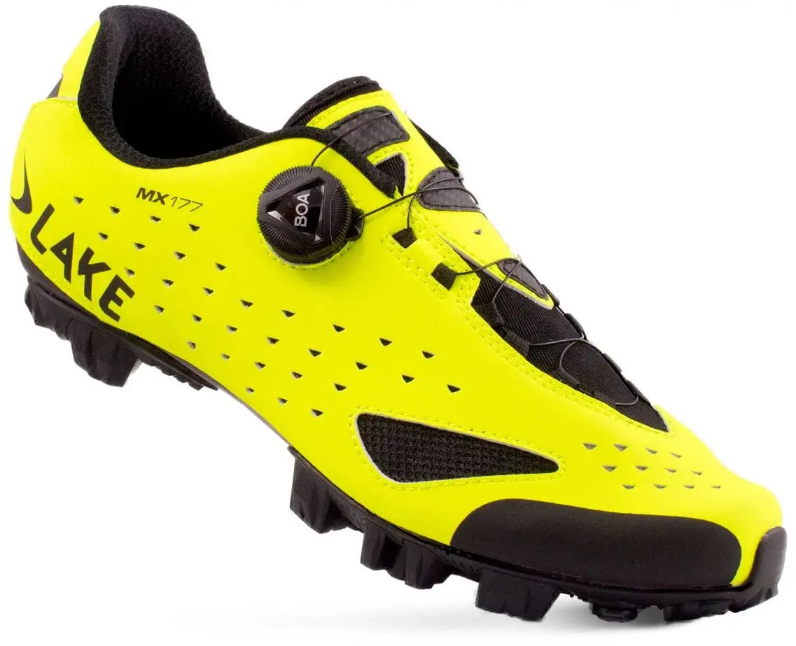 Yellow cycling shoe with black accents on a white background