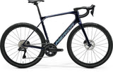 Purple and blue Merida Scultura Endurance 9000 road bike with disc brakes and aerodynamic frame.