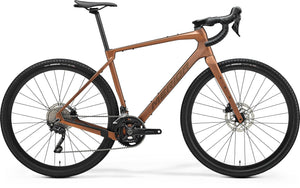 Merida Silex 4000 Gravel Bike in a sleek brown finish, featuring a lightweight carbon frame, drop handlebars, and disc brakes for ultimate adventure performance.