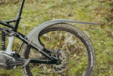 Mudhugger MK2 rear mudguard fitted to the seat stays of a full suspension mountain bike outdoors