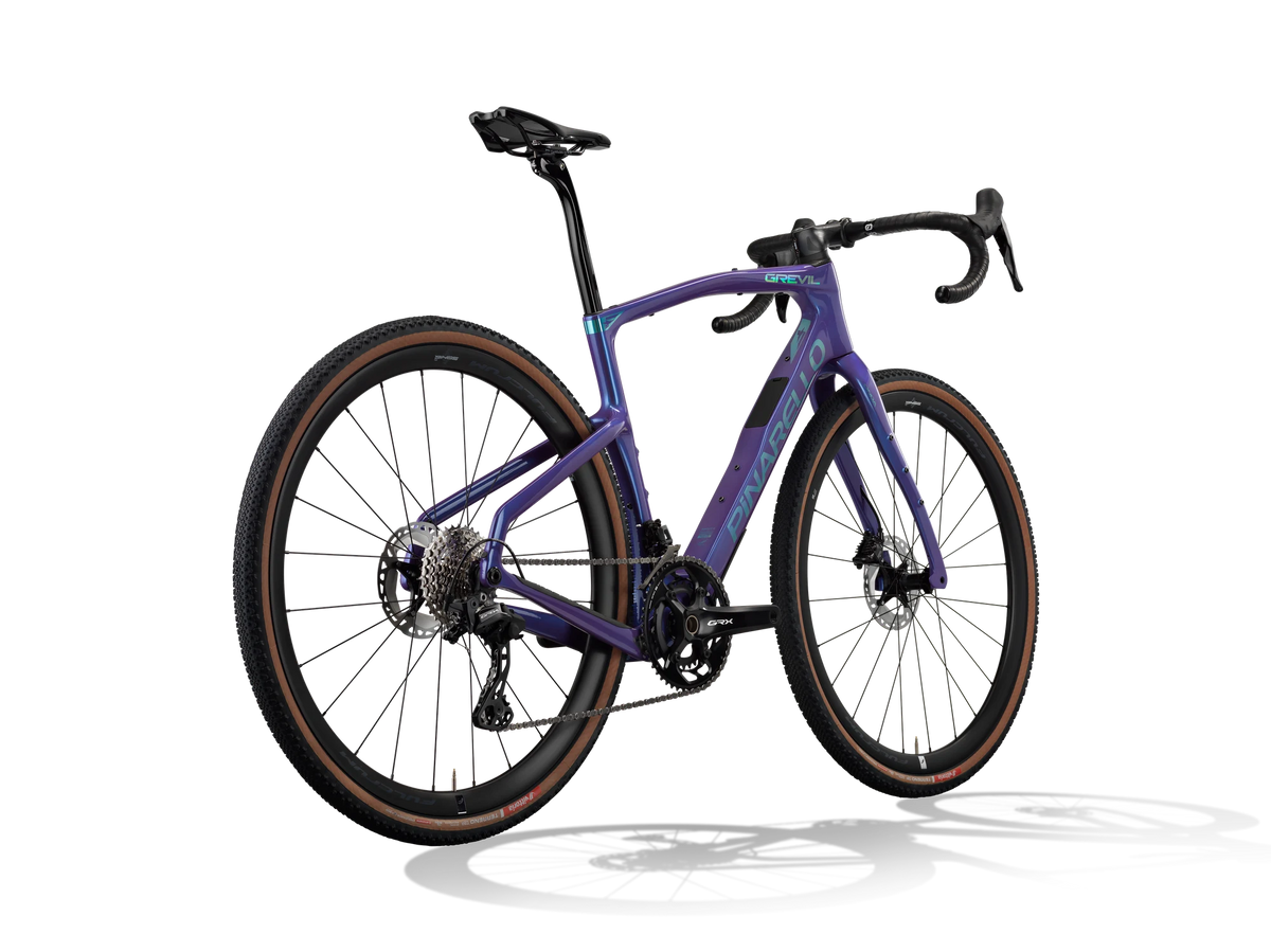 Patagonia Frost Pinarello Grevil F3 gravel bike from a rear three-quarter angle, pictured with a Shimano GRX drivetrain.