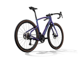 Patagonia Frost Pinarello Grevil F3 gravel bike from a rear three-quarter angle, pictured with a Shimano GRX drivetrain.