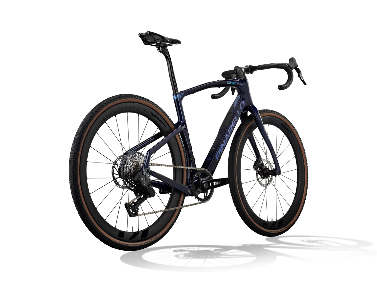 Lapland Sky Pinarello Grevil F5 gravel bike from a rear three-quarter angle showing the rear derailleur and cassette.