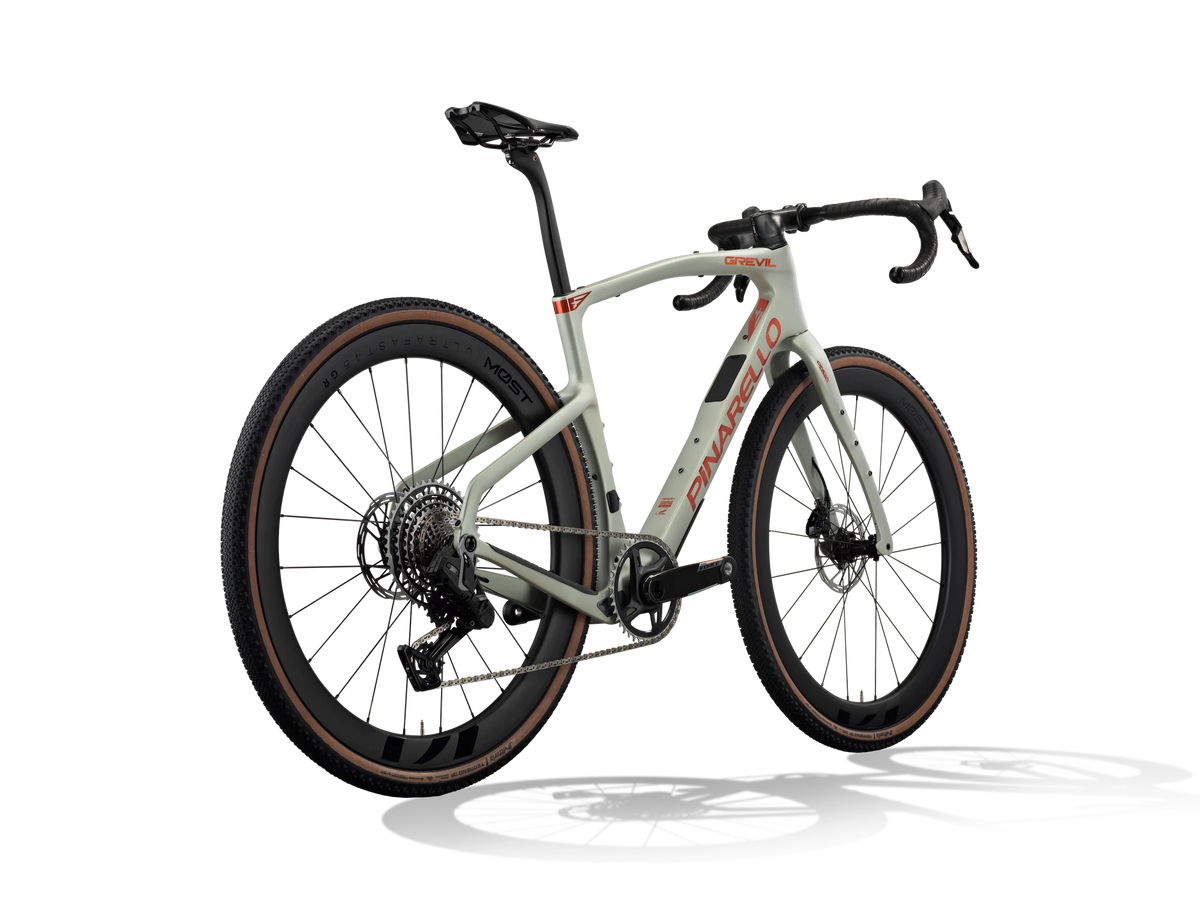 Moab Amber Pinarello Grevil F7 gravel bike from a rear three-quarter angle showing the rear derailleur and cassette.
