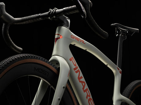 Moab Amber Pinarello Grevil F7 frame detail showing the head tube, top tube and down tube logo.