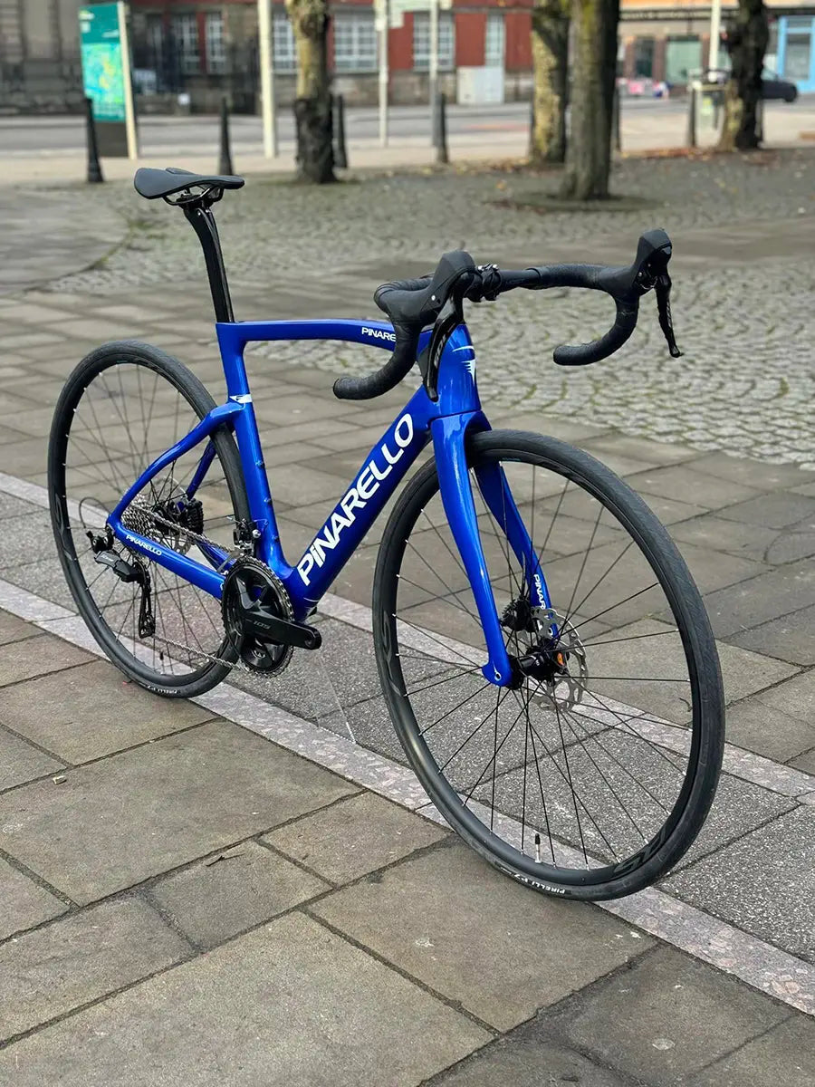 Pinarello F1 bike on cobblestone street