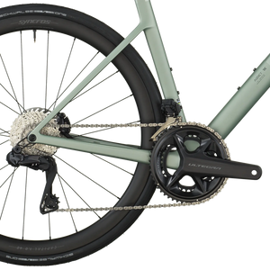 Close-up of a bicycle chain and gear system on a white background