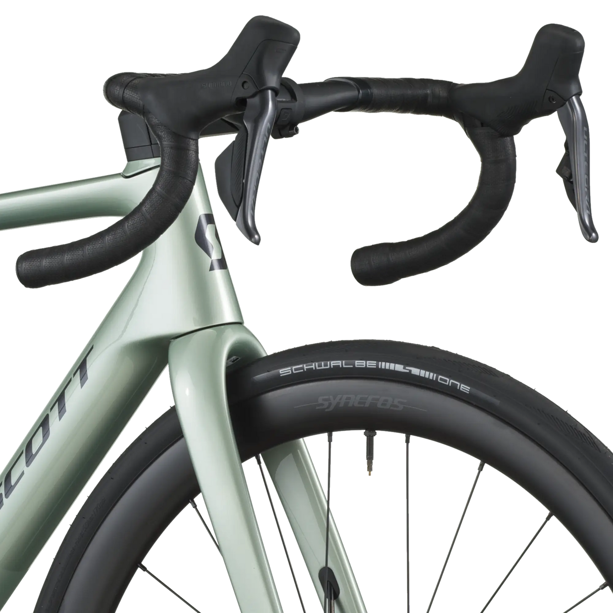 Close-up of a bicycle handlebar and front wheel on a white background