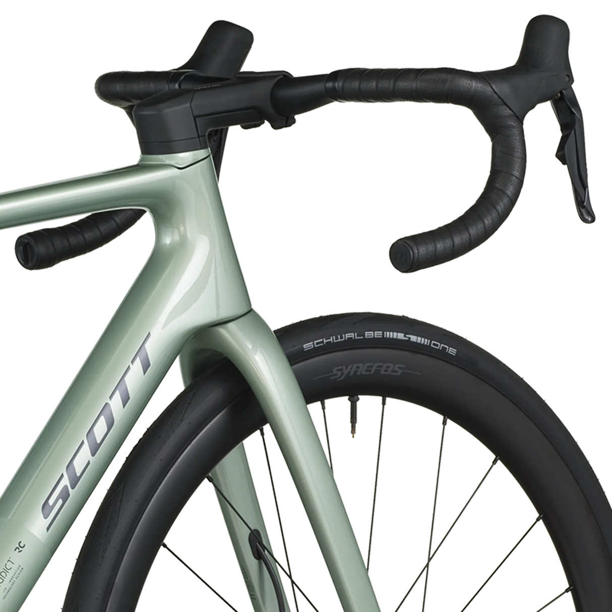 Close-up of a green bicycle with black handlebars on a white background