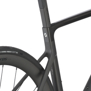Close-up of a black bicycle frame with visible branding on a white background