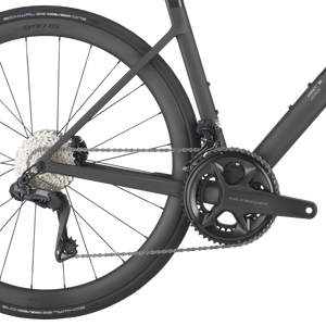 Close-up of a bicycle chain and gear system on a white background