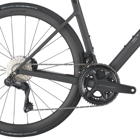 Close-up of a bicycle chain and gear system on a white background