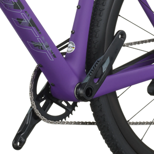 Close-up of a purple bicycle frame with chain and wheel on a white background