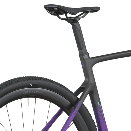 Close-up of a bicycle with a black frame and purple accents on a white background