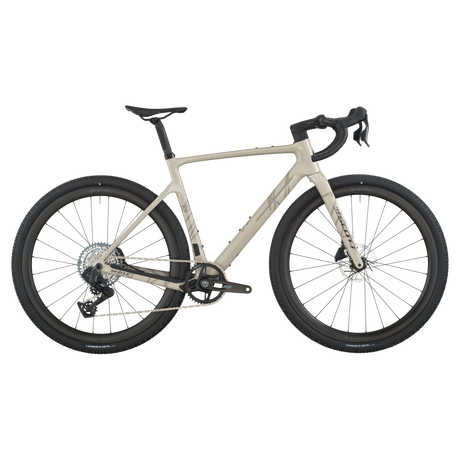 Close-up of a bicycle with beige frame and black tires on a white background