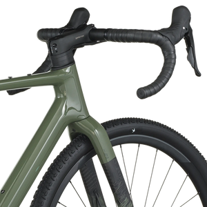 Close-up of a green bicycle with black handlebars on a white background