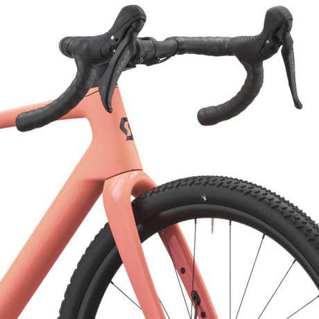 Scott Addict Gravel 40 2027 in peach pink, cockpit and brake hoods