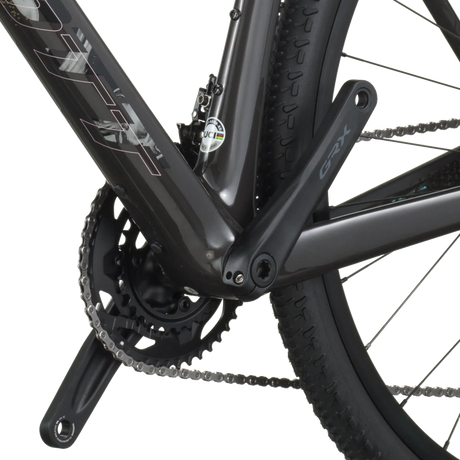 Close-up of a bicycle chain and gear system on a white background
