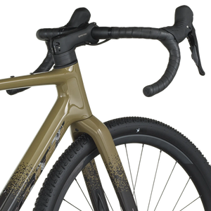 Close-up of a bicycle with a beige frame and black components on a white background