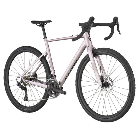 Scott Speedster Gravel 10 in light pink with black accents, angled view highlighting its ergonomic design and all-terrain capabilities.