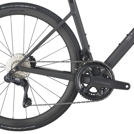 Close-up of the Scott Addict RC 20 Road Bike drivetrain, featuring Shimano Ultegra crankset, rear derailleur, and high-performance chain.