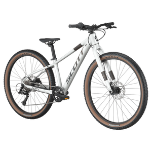Angled view of Scott Scale 600 26" Kids Bike in silver, featuring disc brakes and a lightweight frame for off-road cycling adventures.